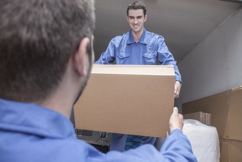 Man with a van loading furniture in Kingston Vale