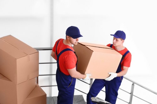 Moving van with recyclable boxes and sorted materials in Kingstonvale