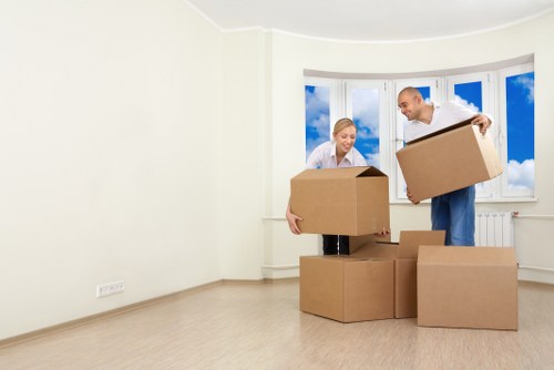 Packed boxes and furniture ready for a Kingston Vale house removal