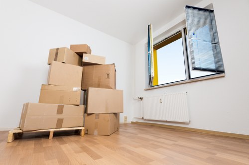Prepared boxes and furniture ready for a Kingston Vale man and van move