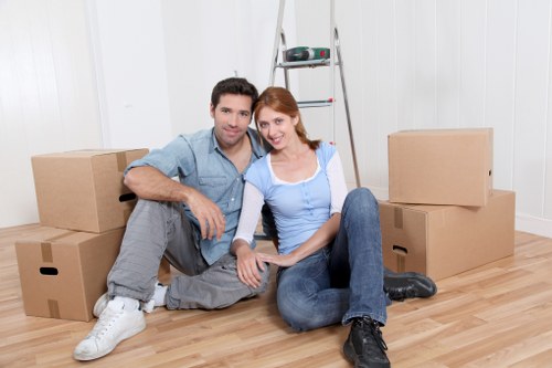 Loading furniture into a van for a local Kingston Vale relocation