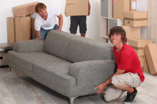 Unpacking boxes in a Kingston Vale property after moving day