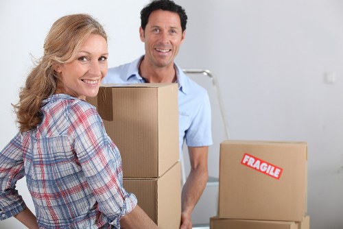 Professional movers loading items for a Kingston Vale relocation