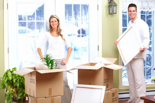 Packed moving boxes and furniture ready for transport