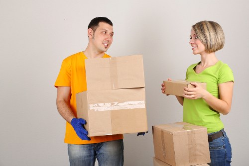 Packed office equipment and labelled boxes ready for relocation